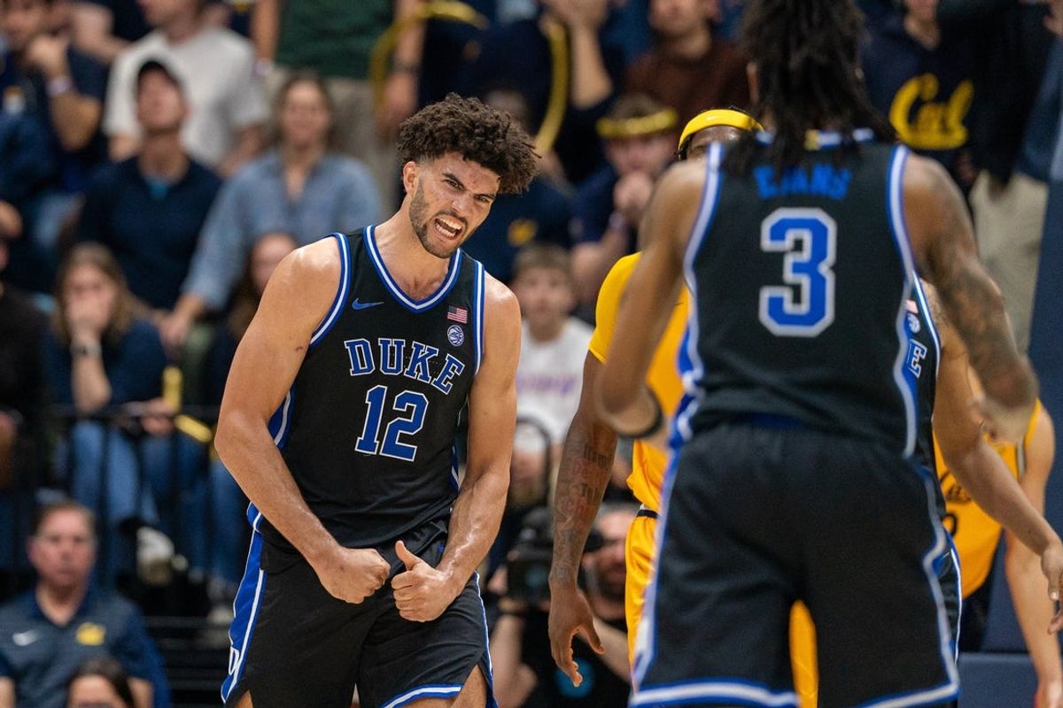 Jan 14, 2026; Berkeley, California, USA; Duke Blue Devils forward Cameron Boozer (12) celebrates after dunking the basketball against the California Golden Bears during the second half at Haas Pavilion. Mandatory Credit: Neville E. Guard-Imagn Images