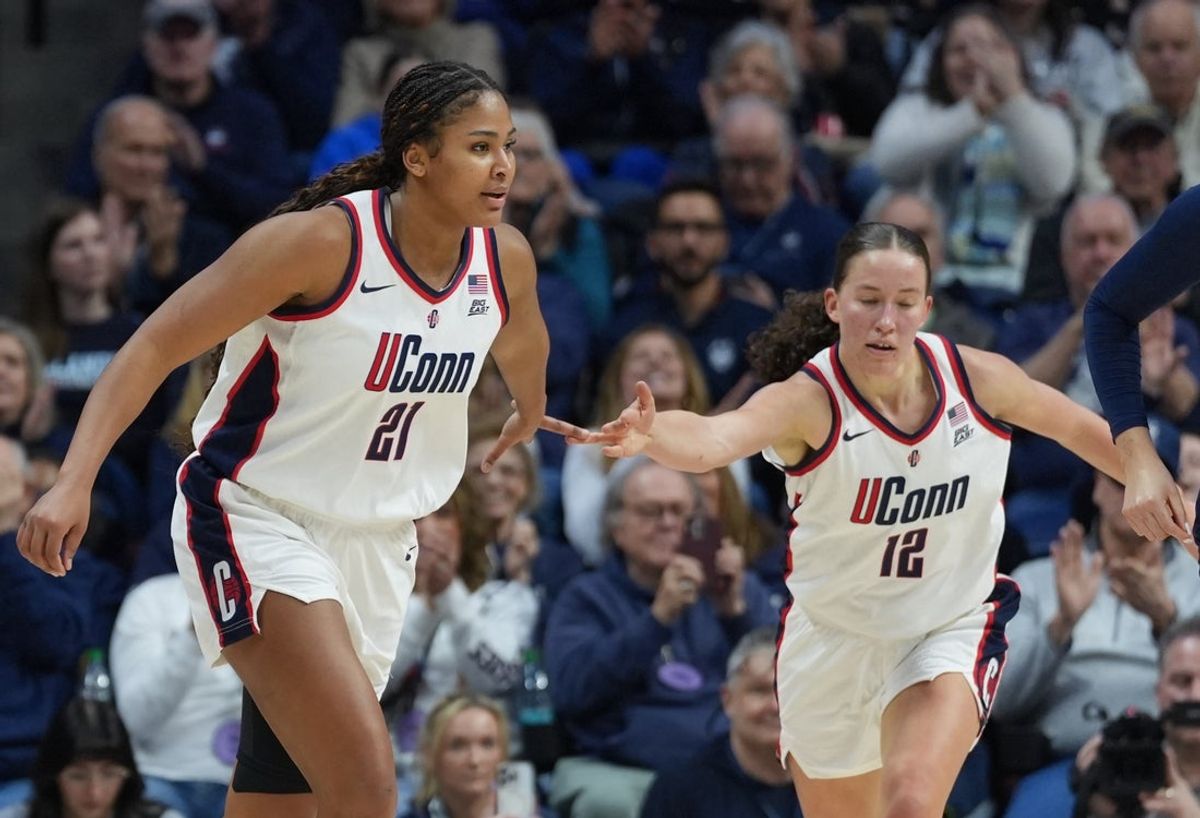 Jan 15, 2026; Storrs, Connecticut, USA; UConn Huskies forward Sarah Strong (21) and guard Ashlynn Shade (12) react after a play against the Villanova Wildcats in the second half at Harry A. Gampel Pavilion. Mandatory Credit: David Butler II-Imagn Images