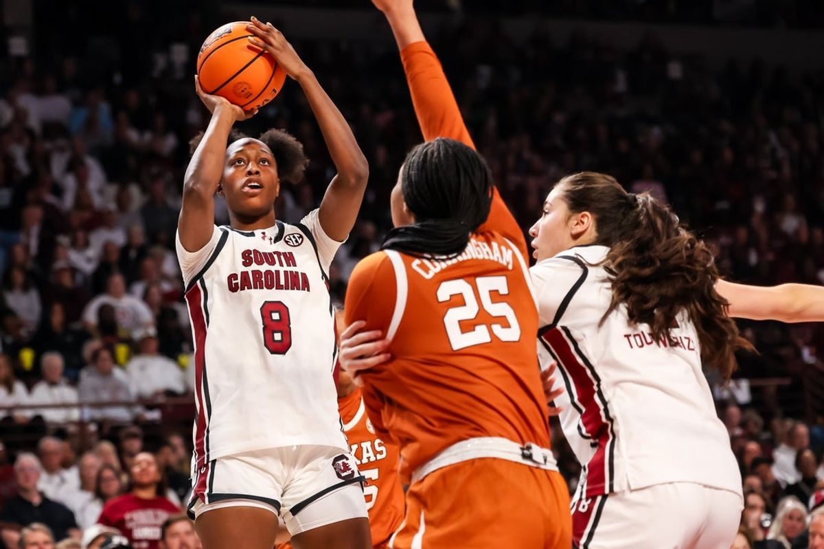 Jan 15, 2026; Columbia, South Carolina, USA; South Carolina Gamecocks forward Joyce Edwards (8) shoots over Texas Longhorns forward Breya Cunningham (25) in the first half at Colonial Life Arena. Mandatory Credit: Jeff Blake-Imagn Images