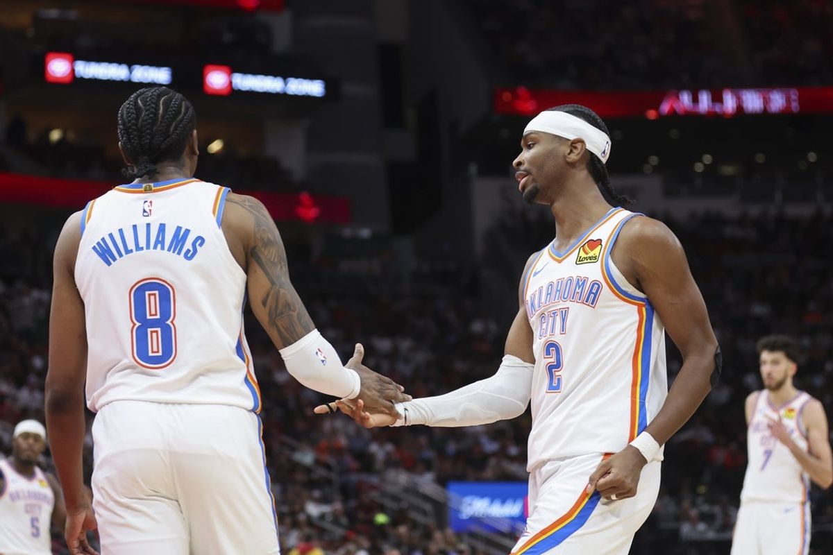 Jan 15, 2026; Houston, Texas, USA; Oklahoma City Thunder guard Jalen Williams (8) and guard Shai Gilgeous-Alexander (2) react after a play during the third quarter against the Houston Rockets at Toyota Center. Mandatory Credit: Troy Taormina-Imagn Images