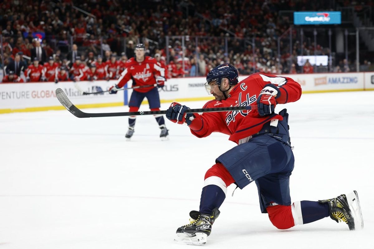 Jan 15, 2026; Washington, District of Columbia, USA; Washington Capitals left wing Alex Ovechkin (8) shoots the puck against the San Jose Sharks during the third period at Capital One Arena. Mandatory Credit: Geoff Burke-Imagn Images