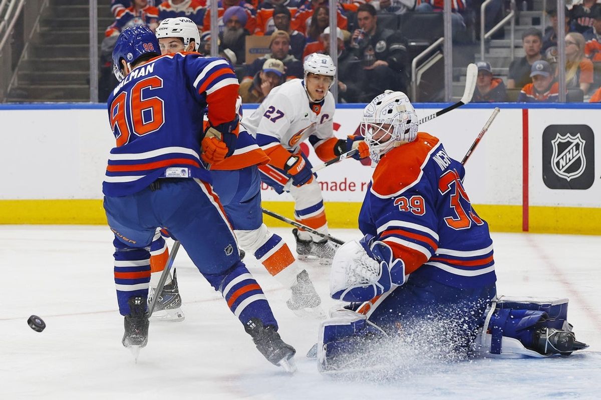 Jan 15, 2026; Edmonton, Alberta, CAN; Edmonton Oilers goaltender Connor Ingram (39) makes a save on a shot by New York Islanders forward Anders Lee (27) during the second periodat Rogers Place. Mandatory Credit: Perry Nelson-Imagn Images