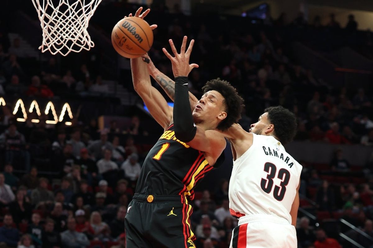 Jan 15, 2026; Portland, Oregon, USA;  Atlanta Hawks forward Jalen Johnson (1) and Portland Trail Blazers forward Toumani Camara (33) battle for a rebound with Portland Trail Blazers forward Toumani Camara (33) during the first half at Moda Center. Mandatory Credit: Jaime Valdez-Imagn Images