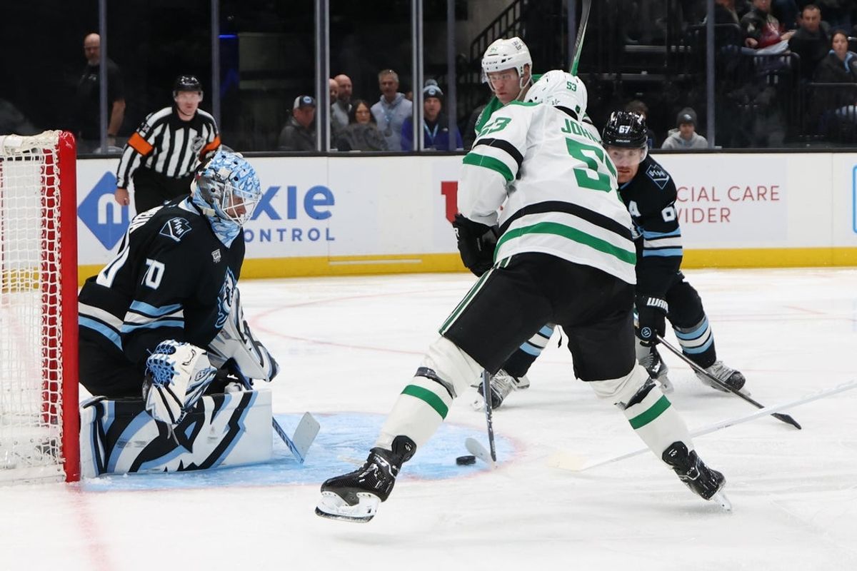 Jan 15, 2026; Salt Lake City, Utah, USA; Dallas Stars center Wyatt Johnston (53) looks to shoot against Utah Mammoth goaltender Karel Vejmelka (70) during the third period at Delta Center. Mandatory Credit: Rob Gray-Imagn Images