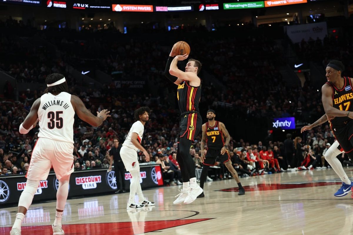 Jan 15, 2026; Portland, Oregon, USA;  Atlanta Hawks guard/forward Luke Kennard (4) shoots the ball over Portland Trail Blazers center/forward Robert Williams III (35) during the second half at Moda Center. Mandatory Credit: Jaime Valdez-Imagn Images