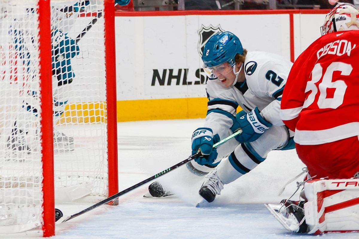 Jan 16, 2026; Detroit, Michigan, USA; San Jose Sharks center Will Smith (2) scores on Detroit Red Wings goaltender John Gibson (36) during the first period at Little Caesars Arena. Mandatory Credit: Brian Bradshaw Sevald-Imagn Images