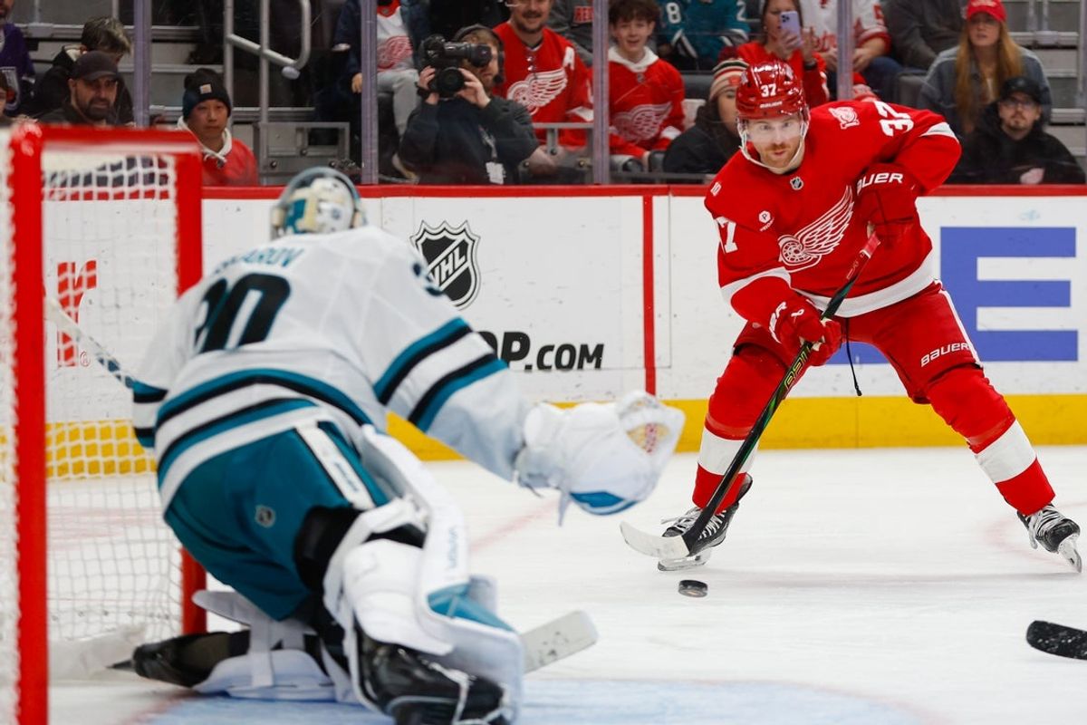 Jan 16, 2026; Detroit, Michigan, USA; Detroit Red Wings left wing J.T. Compher (37) passes the puck during the second period against the San Jose Sharks at Little Caesars Arena. Mandatory Credit: Brian Bradshaw Sevald-Imagn Images