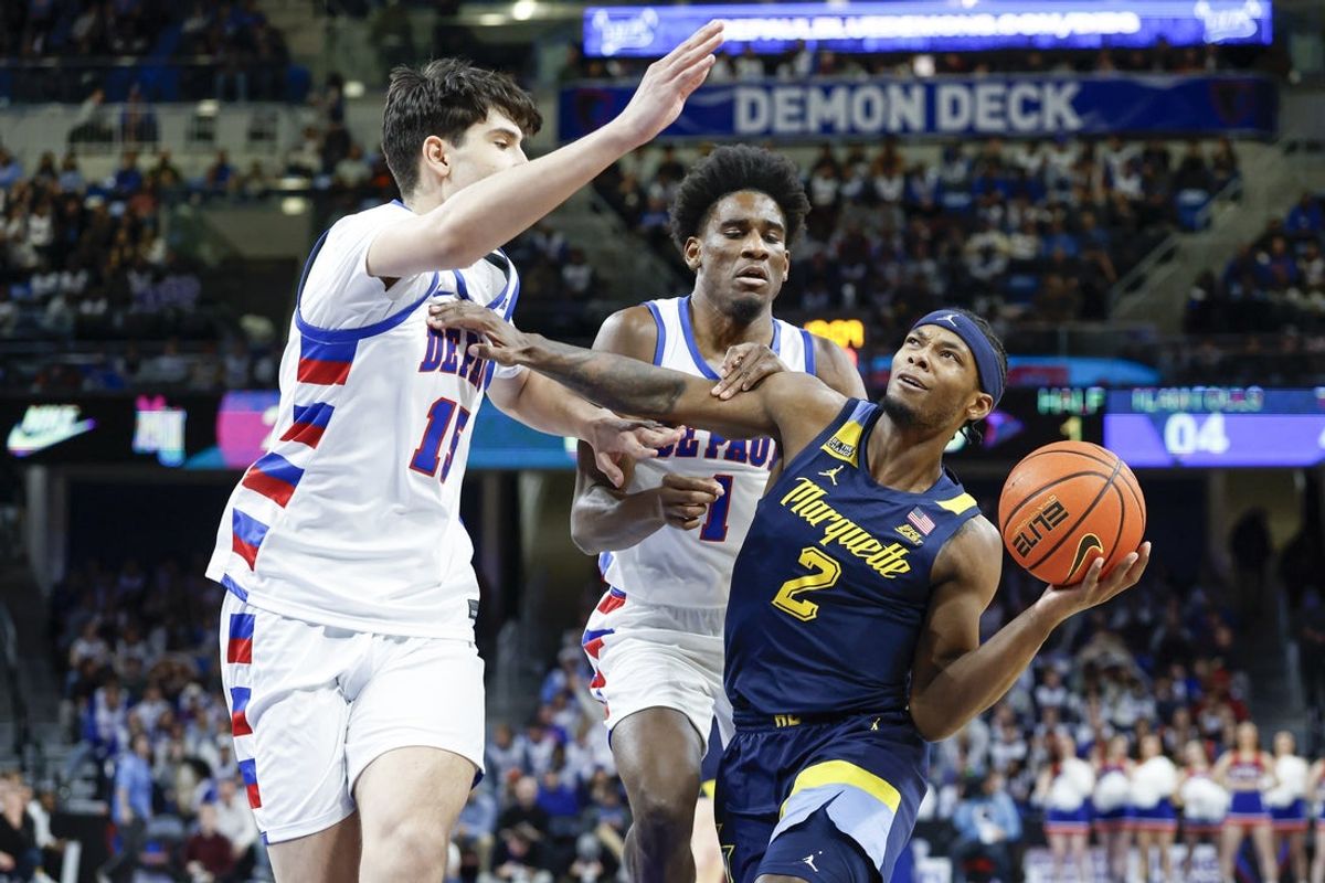 Jan 16, 2026; Chicago, Illinois, USA; Marquette Golden Eagles guard Chase Ross (2) drives to the basket against the DePaul Blue Demons during the first half at Wintrust Arena. Mandatory Credit: Kamil Krzaczynski-Imagn Images