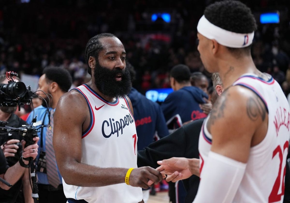 Jan 16, 2026; Toronto, Ontario, CAN; LA Clippers guard James Harden (1) celebrates the win with guard Jordan Miller (22) against the Toronto Raptor at the end of the overtime period at Scotiabank Arena. Mandatory Credit: Nick Turchiaro-Imagn Images