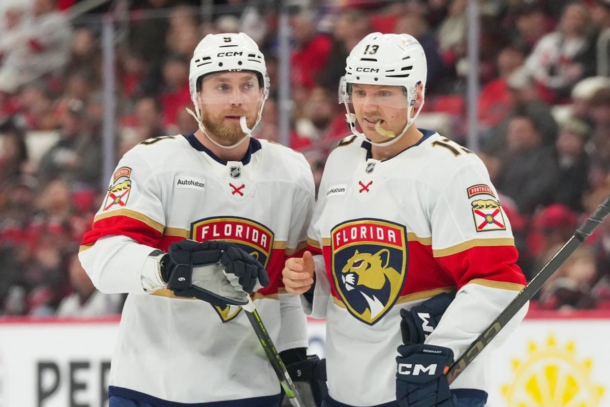 Jan 16, 2026; Raleigh, North Carolina, USA;  Florida Panthers center Sam Reinhart (13) and Florida Panthers center Sam Bennett (9) look on against the Carolina Hurricanes during the second period at Lenovo Center. Mandatory Credit: James Guillory-Imagn Images