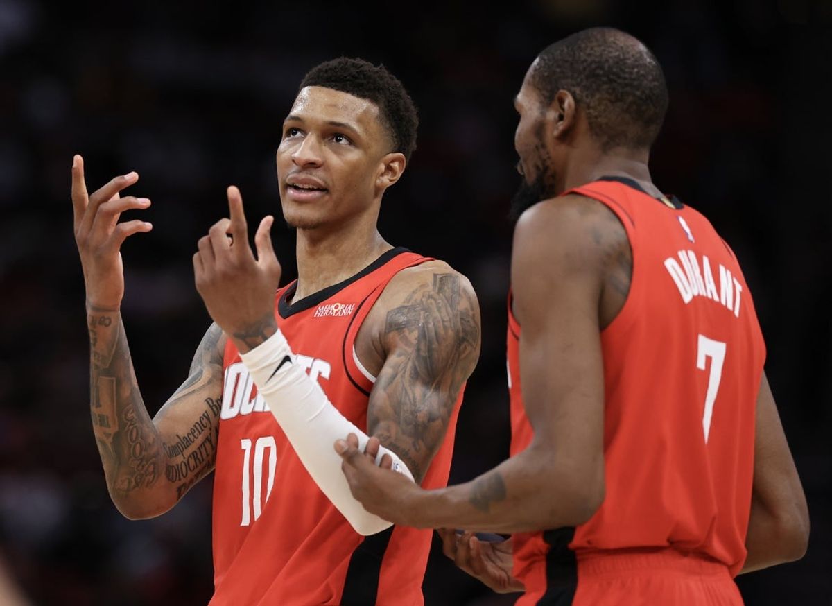 Jan 16, 2026; Houston, Texas, USA; Houston Rockets forward Jabari Smith Jr. (10) talks to forward Kevin Durant (7) during a Minnesota Timberwolves timeout in the second half at Toyota Center. Mandatory Credit: Thomas Shea-Imagn Images