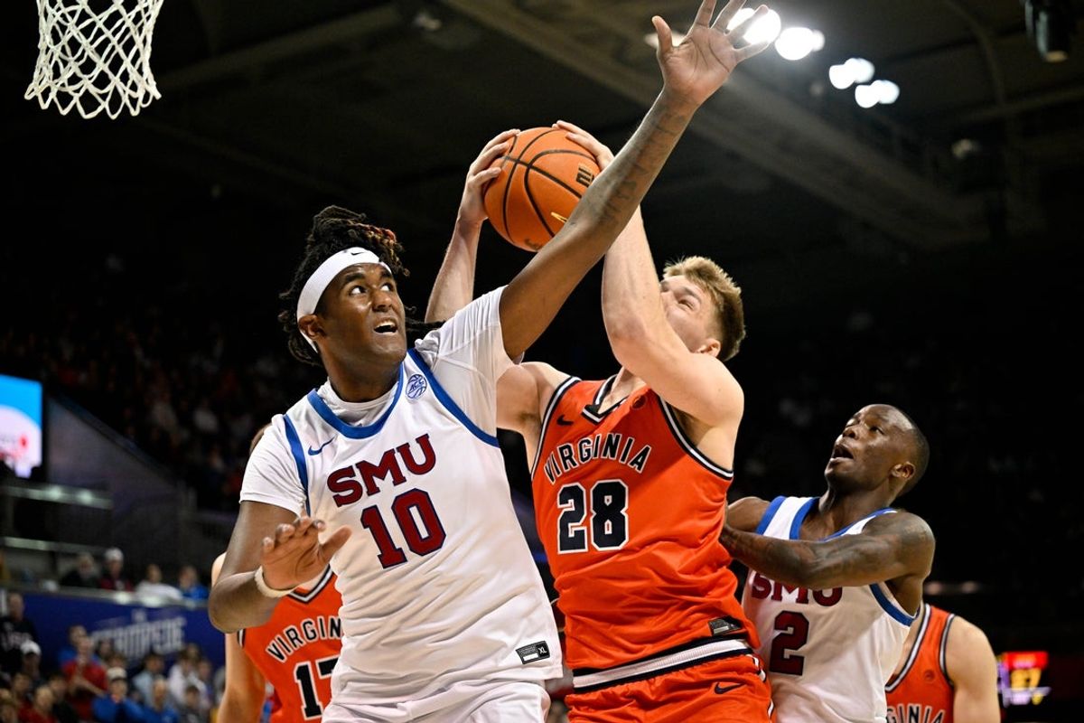 Jan 17, 2026; Dallas, Texas, USA; SMU Mustangs center Jaden Toombs (10) and Virginia Cavaliers forward Thijs de Ridder (28) battle for the rebound during the first half at Moody Coliseum. Mandatory Credit: Jerome Miron-Imagn Images