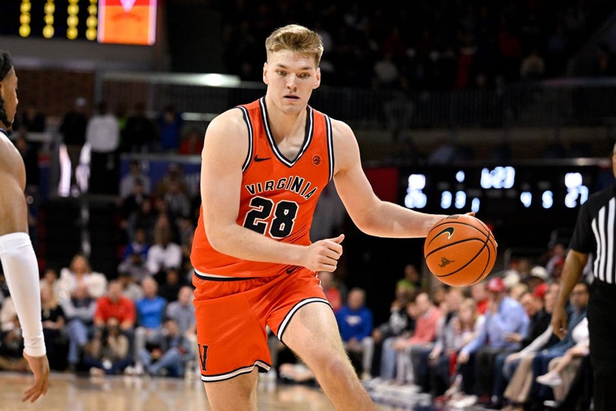 Jan 17, 2026; Dallas, Texas, USA; Virginia Cavaliers forward Thijs de Ridder (28) brings the ball up court against the SMU Mustangs during the first half at Moody Coliseum. Mandatory Credit: Jerome Miron-Imagn Images