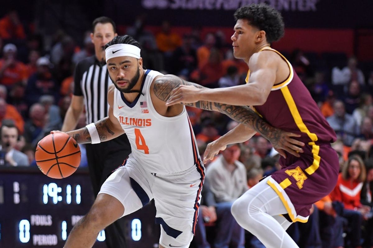 Jan 17, 2026; Champaign, Illinois, USA;  Illinois Fighting Illini guard Kylan Boswell (4) drives the ball around Minnesota Golden Gophers guard Isaac Asuma (1) during the first half at State Farm Center. Mandatory Credit: Ron Johnson-Imagn Images