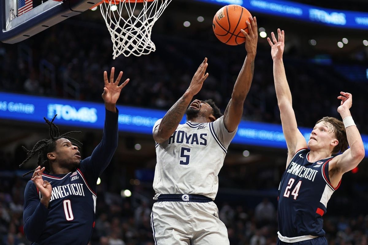 Jan 17, 2026; Washington, District of Columbia, USA; Georgetown Hoyas guard KJ Lewis (5) takes a shot over UConn Huskies guard Malachi Smith (0) and UConn Huskies guard Braylon Mullins (24) during the first half at Capital One Arena. Mandatory Credit: Daniel Kucin Jr.-Imagn Images