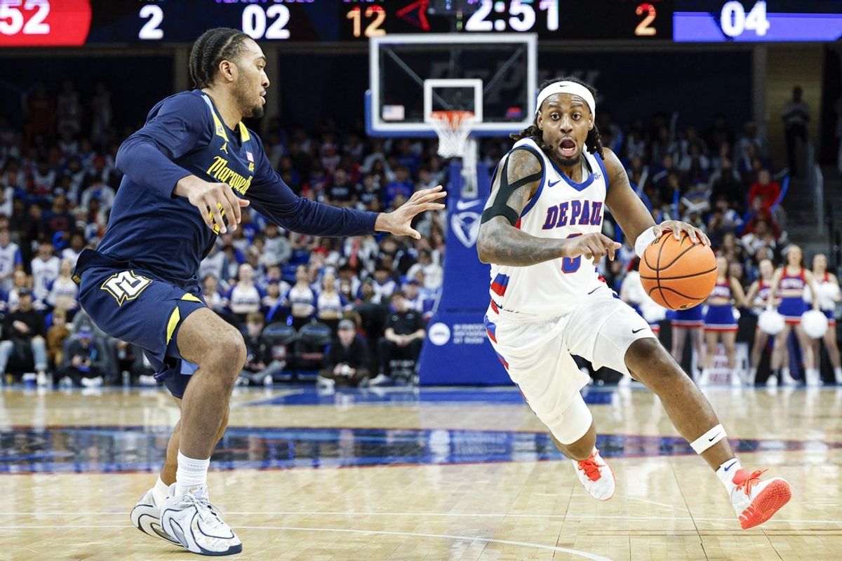 Jan 16, 2026; Chicago, Illinois, USA; DePaul Blue Demons guard Brandon Maclin (0) drives to the basket against Marquette Golden Eagles guard Adrien Stevens (10) during the second half at Wintrust Arena. Mandatory Credit: Kamil Krzaczynski-Imagn Images