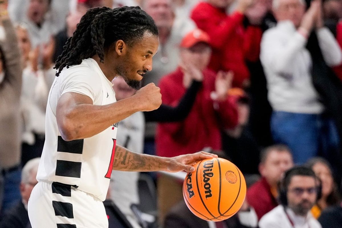 Cincinnati Bearcats guard Day Day Thomas (1) pumps his fist as time expires in the second half of the NCAA Big 12 basketball game between the Cincinnati Bearcats and the Iowa State Cyclones at Fifth Third Stadium in Cincinnati on Saturday, Jan. 17, 2026. The Bearcats upset the No. 2 Cyclones, winning 79-70.