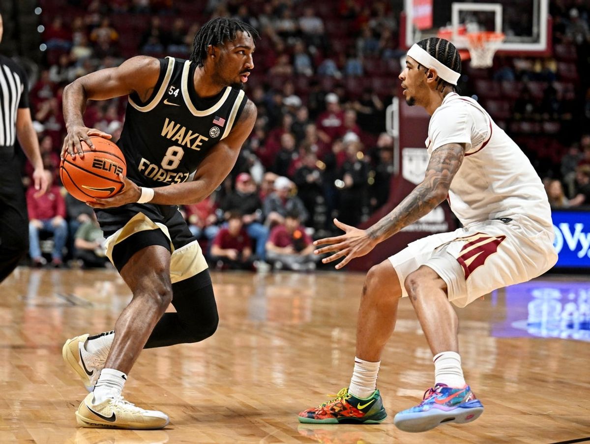 Jan 17, 2026; Tallahassee, Florida, USA; Wake Forest Demon Deacons guard Mekhi Mason (8) looks to pass the ball against Florida State Seminoles guard Cam Miles (2) during the first half at Donald L. Tucker Center. Mandatory Credit: Melina Myers-Imagn Images