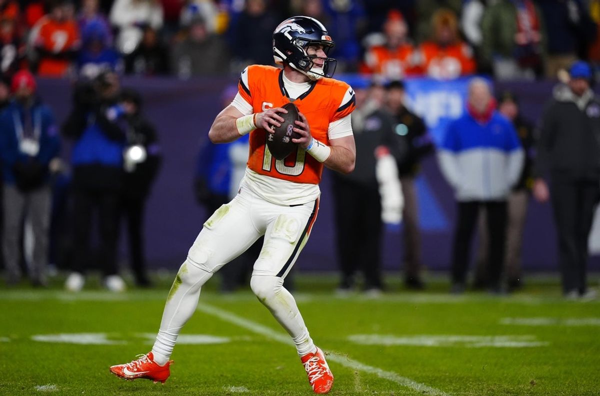 Jan 17, 2026; Denver, CO, USA; Denver Broncos quarterback Bo Nix (10) drops to throw during the fourth quarter of an AFC Divisional Round playoff game against the Buffalo Bills at Empower Field at Mile High. Mandatory Credit: Ron Chenoy-Imagn Images