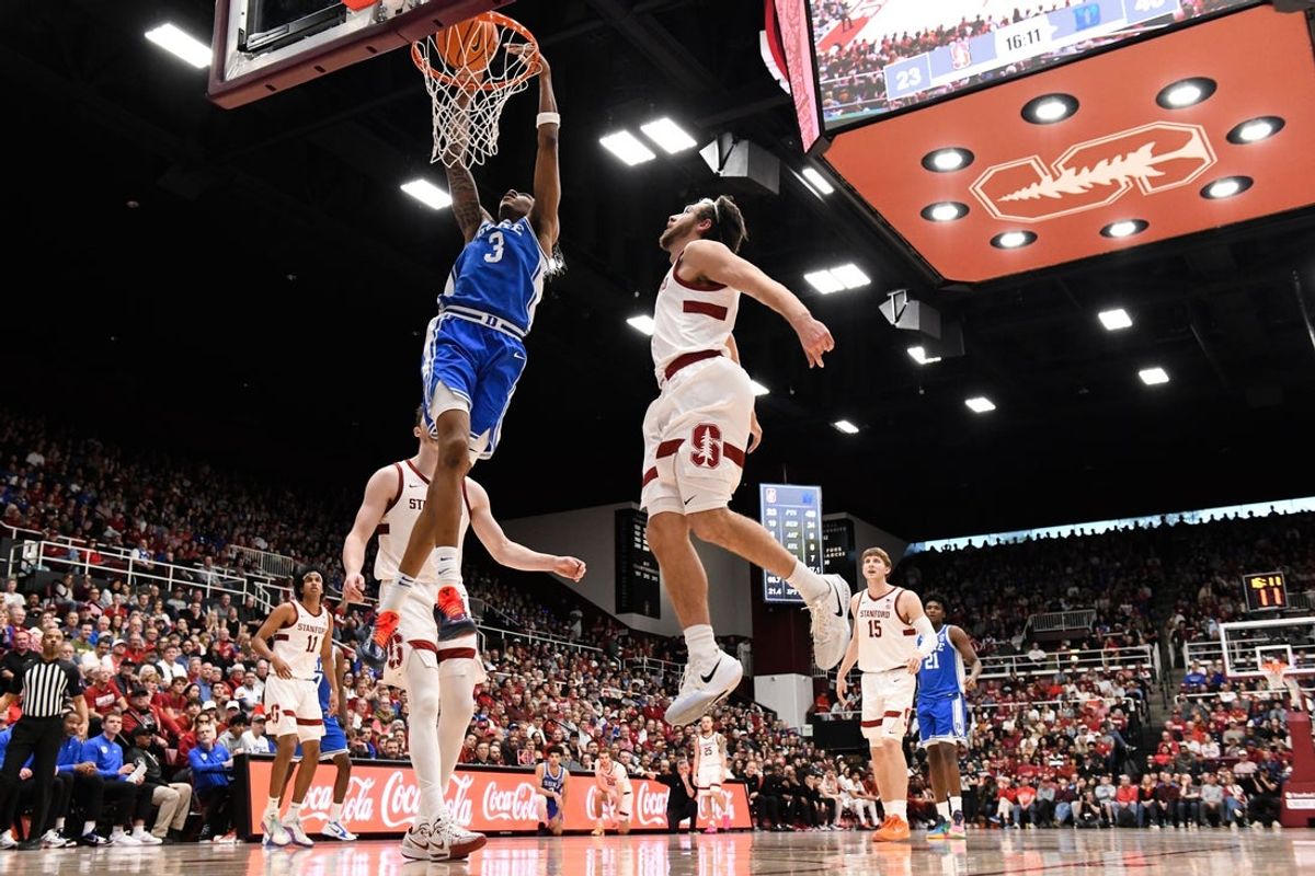 Jan 17, 2026; Stanford, California, USA; Duke Blue Devils guard Isaiah Evans (3) dunks against Stanford Cardinal guard Benny Gealer (5) in the second half at Maples Pavilion. Mandatory Credit: Eakin Howard-Imagn Images
