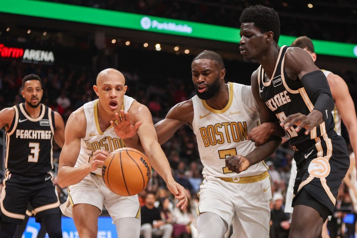 Jan 17, 2026; Atlanta, Georgia, USA; Boston Celtics guard Jordan Walsh (27) and guard Jaylen Brown (7) and Atlanta Hawks forward Mouhamed Gueye (18) fight for a loose ball in the first quarter at State Farm Arena. Mandatory Credit: Brett Davis-Imagn Images
