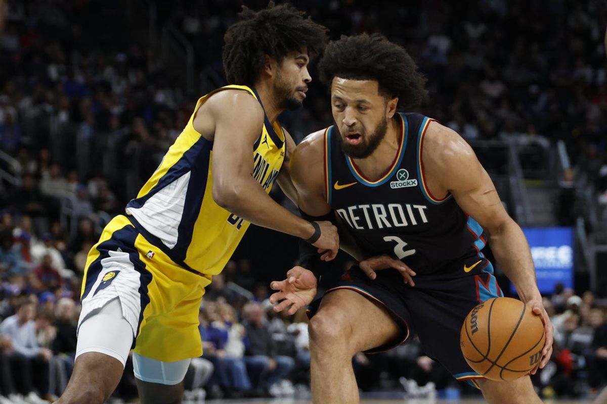 Jan 17, 2026; Detroit, Michigan, USA;  Detroit Pistons guard Cade Cunningham (2) dribbles defended by Indiana Pacers guard Ethan Thompson (55) in the first half at Little Caesars Arena. Mandatory Credit: Rick Osentoski-Imagn Images