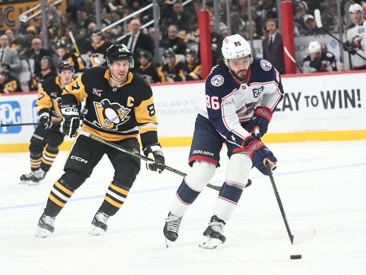 Jan 17, 2026; Pittsburgh, Pennsylvania, USA;  Columbus Blue Jackets right wing Kirill Marchenko (86) takes a break away in front of Pittsburgh Penguins center Sidney Crosby (87) for a goal during the second period at PPG Paints Arena. Mandatory Credit: Philip G. Pavely-Imagn Images