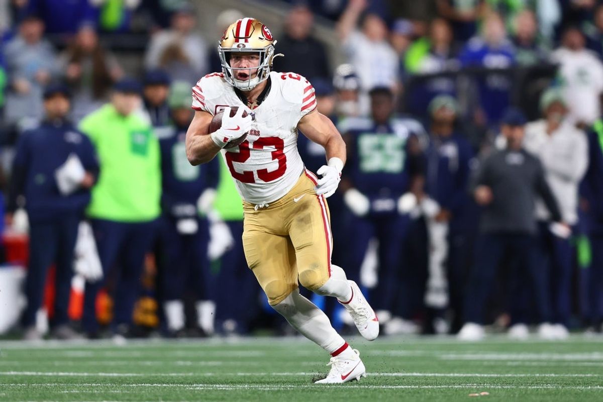 Jan 17, 2026; Seattle, WA, USA; San Francisco 49ers running back Christian McCaffrey (23) runs after the catch against the Seattle Seahawks during the first half in an NFC Divisional Round game at Lumen Field. Mandatory Credit: Kevin Ng-Imagn Images
