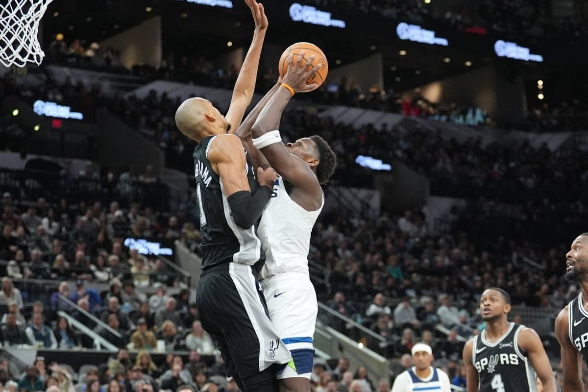 Jan 17, 2026; San Antonio, Texas, USA; Minnesota Timberwolves guard Anthony Edwards (5) shoots against San Antonio Spurs forward Victor Wembanyama (1) in the first half at Frost Bank Center. Mandatory Credit: Daniel Dunn-Imagn Images