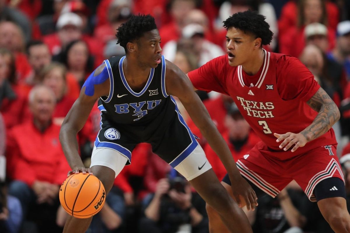 Jan 17, 2026; Lubbock, Texas, USA;  BYU Cougars forward AJ Dybantsa (3) looks for an opening around Texas Tech Red Raiders forward LeJuan Watts (3) in the first half at United Supermarkets Arena. Mandatory Credit: Michael C. Johnson-Imagn Images