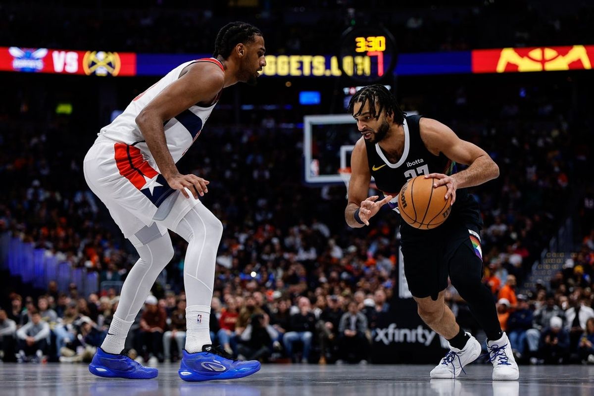 Jan 17, 2026; Denver, Colorado, USA; Denver Nuggets guard Jamal Murray (27) controls the ball as Washington Wizards center Alex Sarr (20) defends in the second quarter at Ball Arena. Mandatory Credit: Isaiah J. Downing-Imagn Images