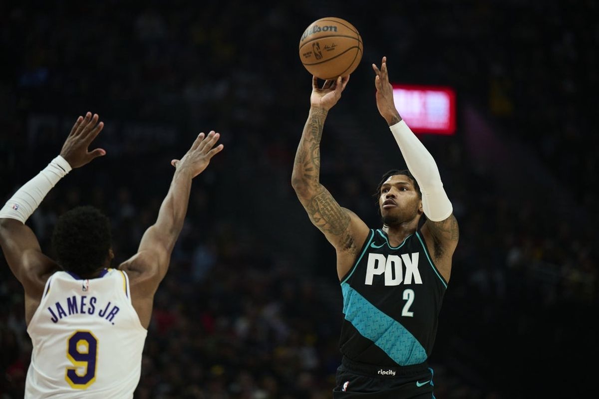 Jan 17, 2026; Portland, Oregon, USA; Portland Trail Blazers guard Caleb Love (2) shoots a jump shot during the first half against Los Angeles Lakers guard Bronny James (9) at Moda Center. Mandatory Credit: Troy Wayrynen-Imagn Images