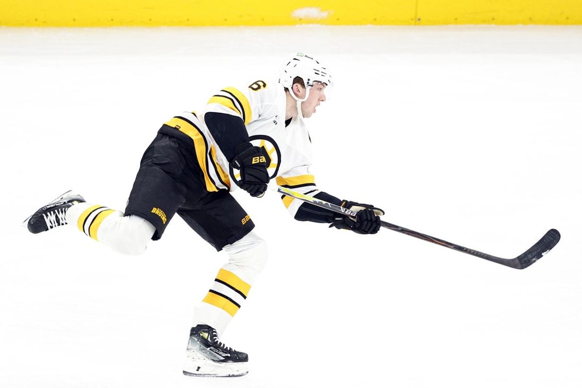 Jan 17, 2026; Chicago, Illinois, USA; Boston Bruins defenseman Mason Lohrei (6) shoots and scores against the Chicago Blackhawks during the third period at United Center. Mandatory Credit: Kamil Krzaczynski-Imagn Images