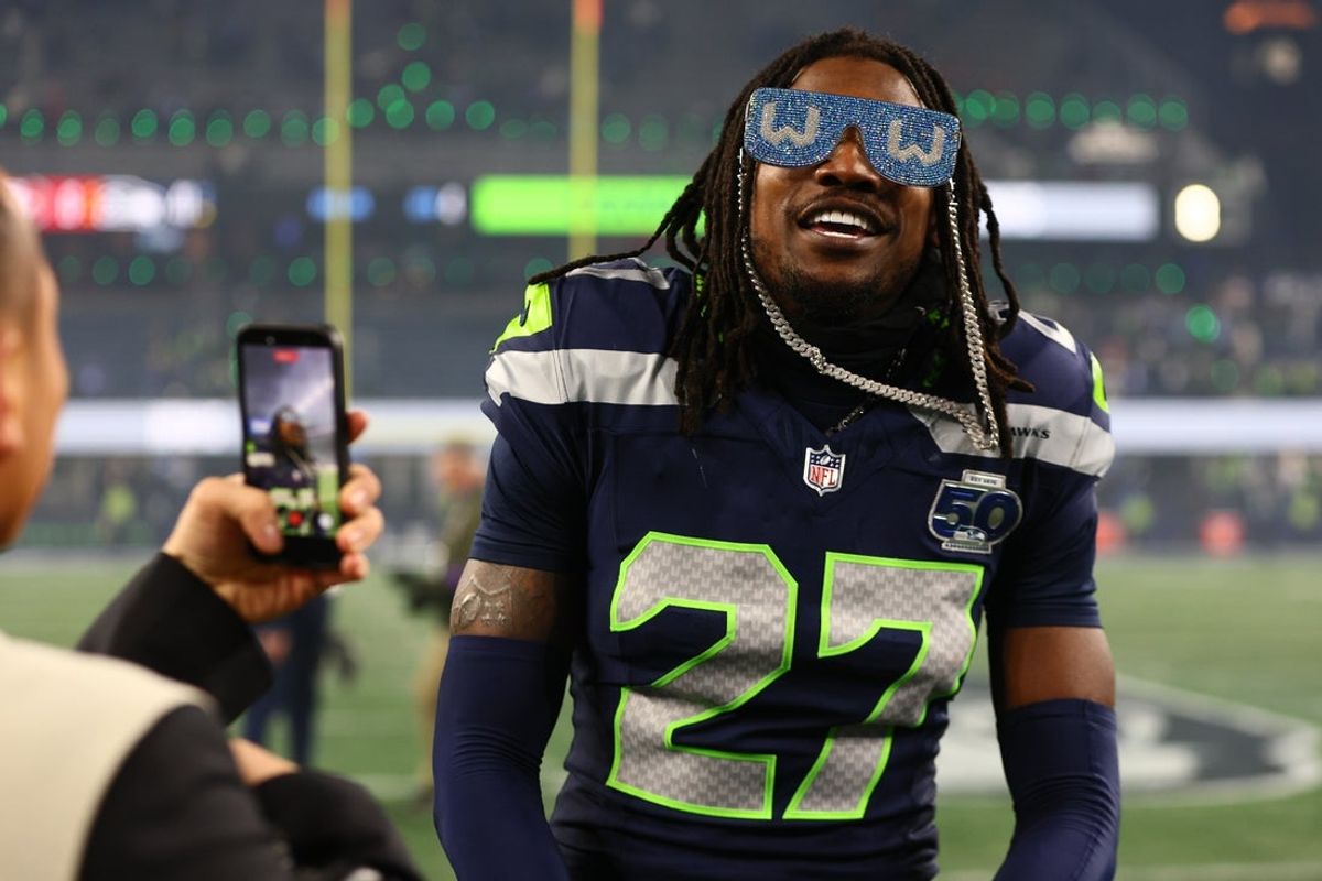 Jan 17, 2026; Seattle, WA, USA;  Seattle Seahawks cornerback Riq Woolen (27) celebrates following an NFC Divisional Round game against the San Francisco 49ers at Lumen Field. Mandatory Credit: Kevin Ng-Imagn Images