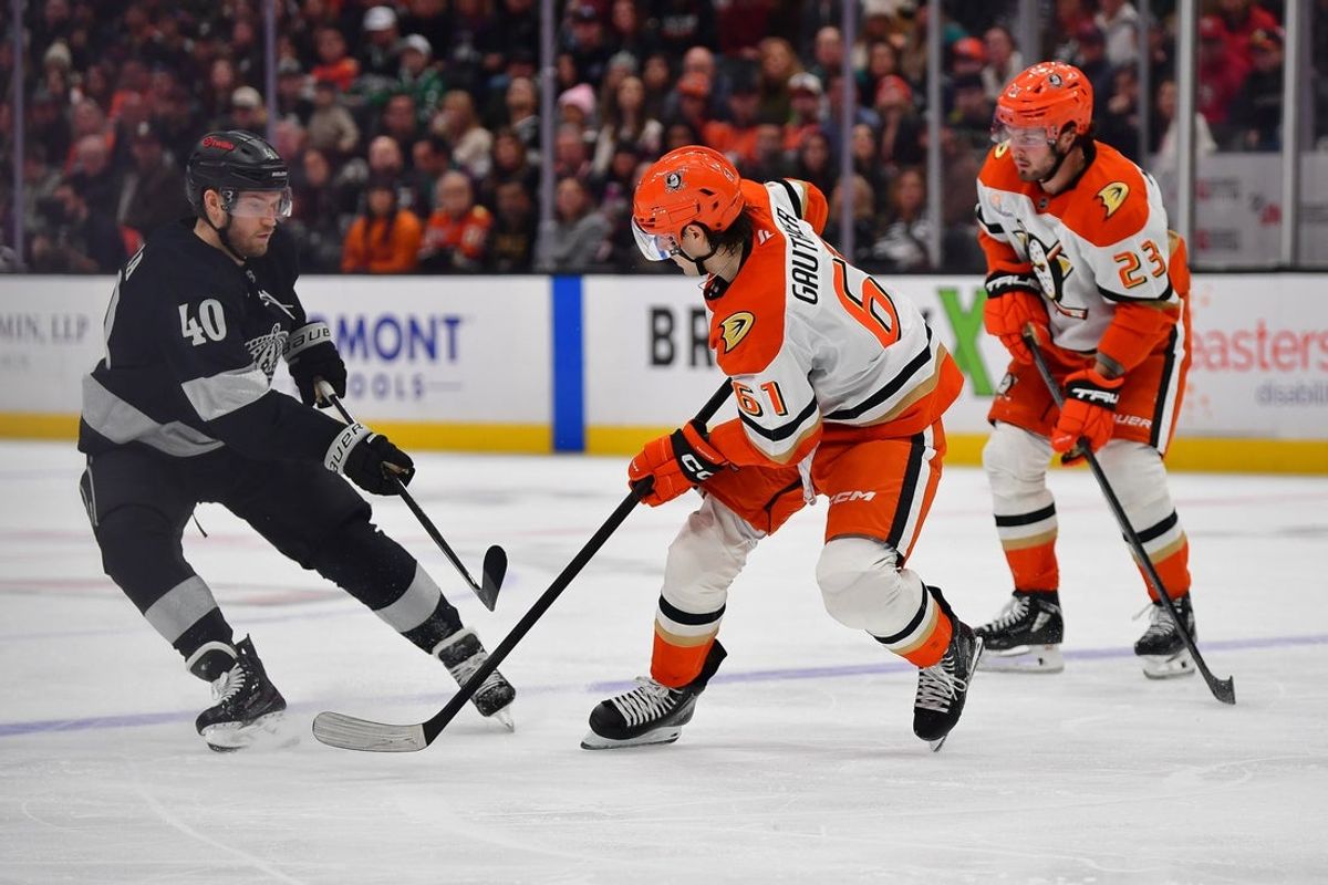 Jan 17, 2026; Anaheim, California, USA; Los Angeles Kings right wing Joel Armia (40) shoots against Anaheim Ducks left wing Cutter Gauthier (61) during the second period at Honda Center. Mandatory Credit: Gary A. Vasquez-Imagn Images