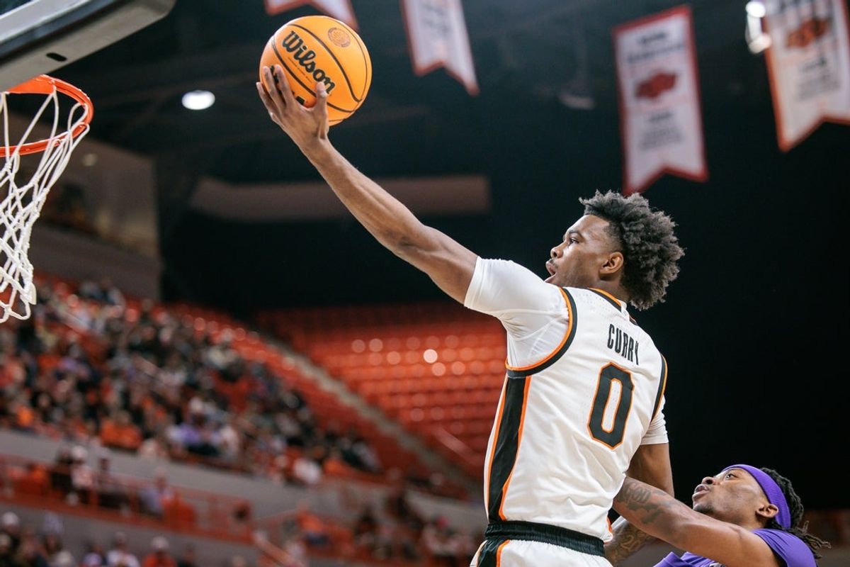 Jan 17, 2026; Stillwater, Oklahoma, USA; Jaylen Curry (0) of the Oklahoma State Cowboys shoots the ball during the first half against the Kansas State Wildcats at Gallagher-Iba Arena. Mandatory Credit: William Purnell-Imagn Images