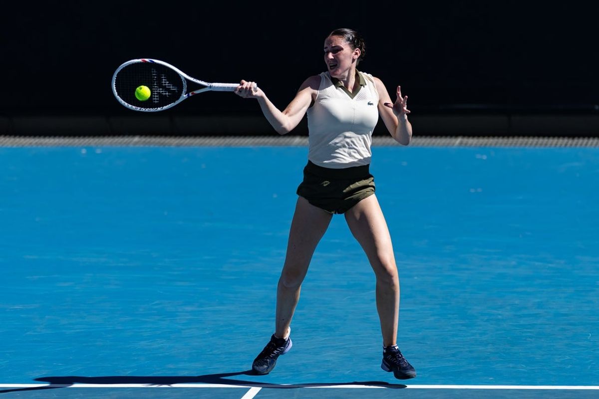 Jan 18, 2026; Melbourne, Victoria, Australia; Elsa Jacquemot of France in action against Marta Kostyuk of Ukraine in the first round of the women’s singles at the Australian Open at ANZ Arena in Melbourne Park. Mandatory Credit: Mike Frey-Imagn Images