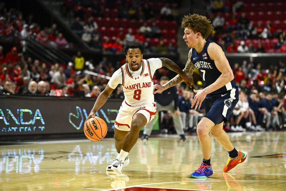 Jan 18, 2026; College Park, Maryland, USA; Maryland Terrapins guard David Coit (8) drives to the basket on Penn State Nittany Lions guard Dominick Stewart (7) during the second half  at Xfinity Center. Mandatory Credit: Tommy Gilligan-Imagn Images