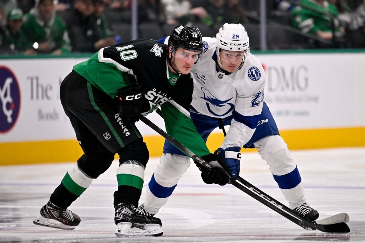 Jan 18, 2026; Dallas, Texas, USA; Dallas Stars center Oskar Beck (10) and Tampa Bay Lightning right wing Pontus Holmberg (29) look for the puck on the face-off during the first period at the American Airlines Center. Mandatory Credit: Jerome Miron-Imagn Images