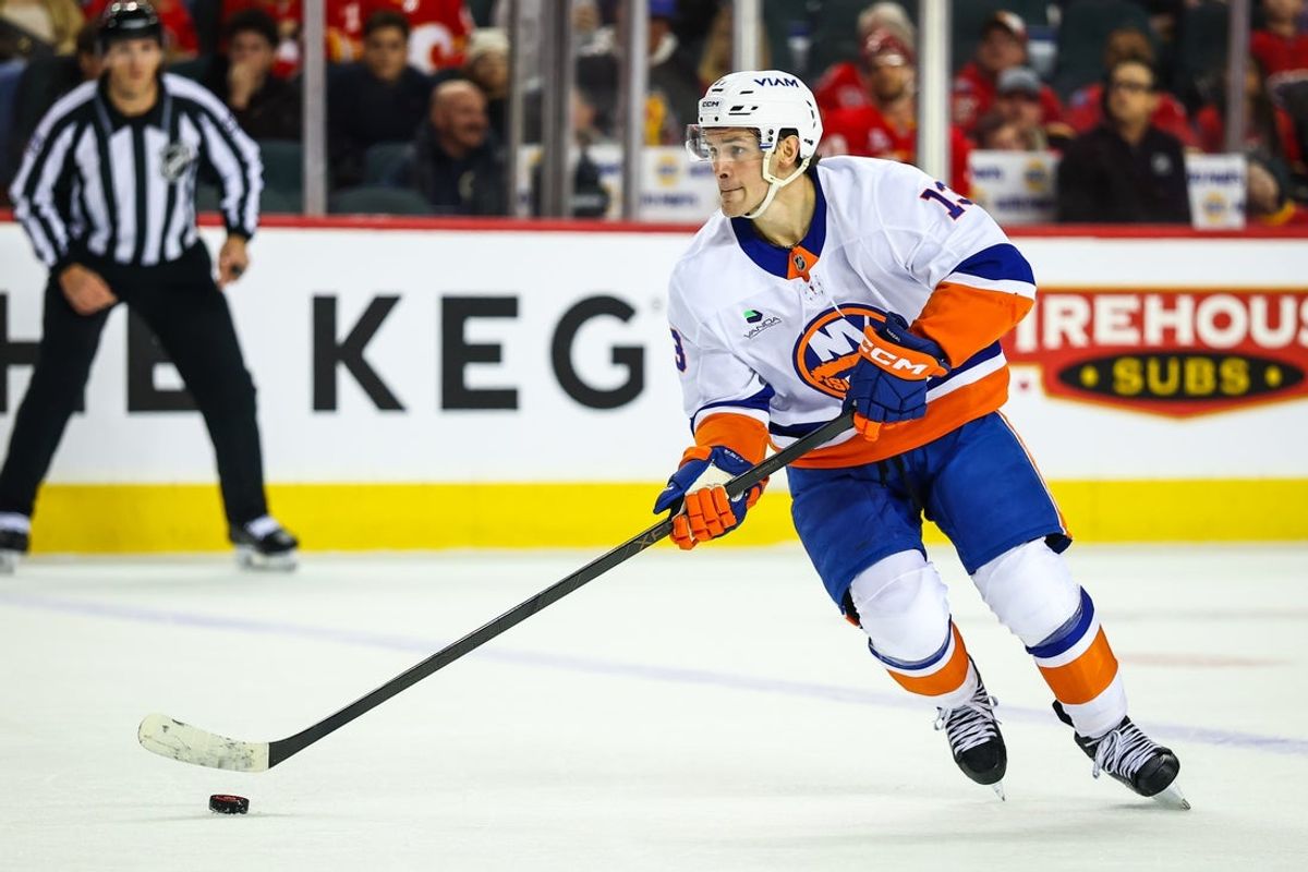 Jan 17, 2026; Calgary, Alberta, CAN; New York Islanders center Mathew Barzal (13) skates with the puck against the Calgary Flames during the third period at Scotiabank Saddledome. Mandatory Credit: Sergei Belski-Imagn Images