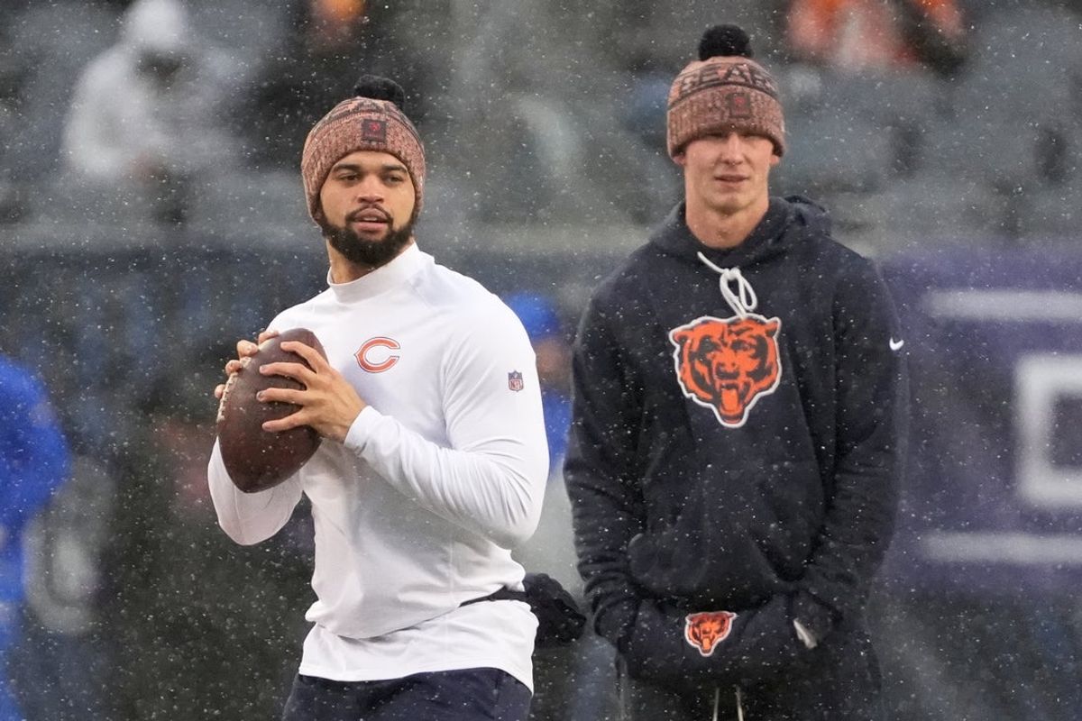 Jan 18, 2026; Chicago, IL, USA; Chicago Bears quarterback Caleb Williams (18) warms up while quarterback Tyson Bagent (17) looks on before an NFC Divisional Round game against the Los Angeles Rams at Soldier Field. Mandatory Credit: David Banks-Imagn Images