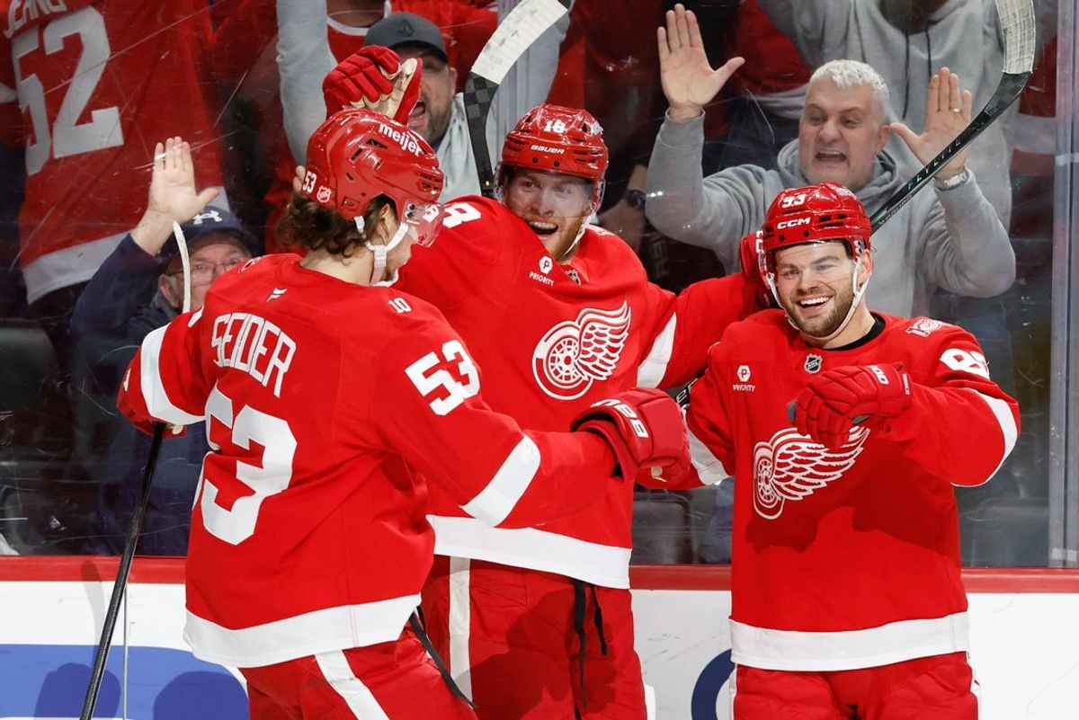 Jan 18, 2026; Detroit, Michigan, USA;  Detroit Red Wings right wing Alex DeBrincat (93) is congratulated by teammates after scoring in overtime against the Ottawa Senators at Little Caesars Arena. Mandatory Credit: Rick Osentoski-Imagn Images