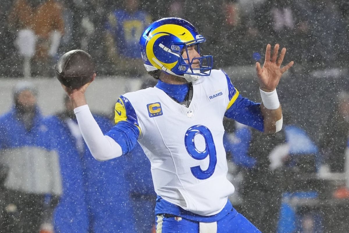 Jan 18, 2026; Chicago, IL, USA; Los Angeles Rams quarterback Matthew Stafford (9) throws a pass against the Chicago Bears during the second quarter of an NFC Divisional Round game at Soldier Field. Mandatory Credit: David Banks-Imagn Images
