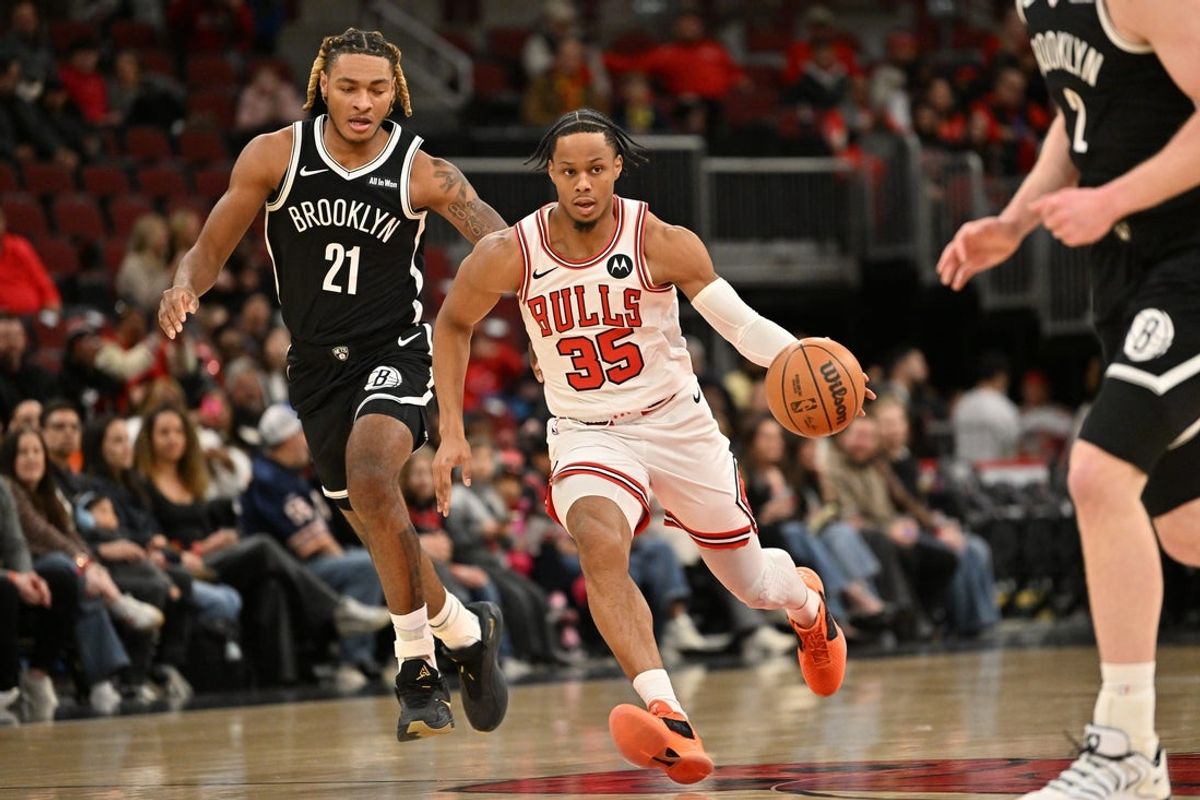 Jan 18, 2026; Chicago, Illinois, USA; Chicago Bulls forward Isaac Okoro (35) dribbles against Brooklyn Nets forward Noah Clowney (21) during the first half at United Center. Mandatory Credit: Patrick Gorski-Imagn Images