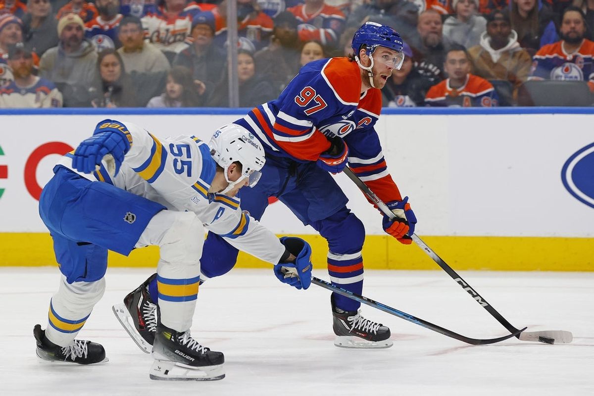 Jan 18, 2026; Edmonton, Alberta, CAN; St. Louis Blues defensemen Colton Parayko (55) defends Edmonton Oilers forward Connor McDavid (97) during the first period at Rogers Place. Mandatory Credit: Perry Nelson-Imagn Images