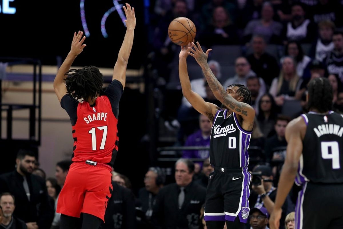 Jan 18, 2026; Sacramento, California, USA; Sacramento Kings guard Malik Monk (0) shoots over Portland Trail Blazers guard Shaedon Sharpe (17) during the second quarter at Golden 1 Center. Mandatory Credit: Dennis Lee-Imagn Images
