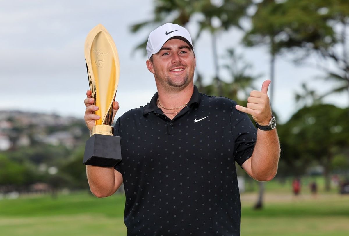 Jan 18, 2026; Honolulu, Hawaii, USA; Chris Gotterup holds the championship trophy after winning the Sony Open in Hawaii. Mandatory Credit: Marco Garcia-Imagn Images