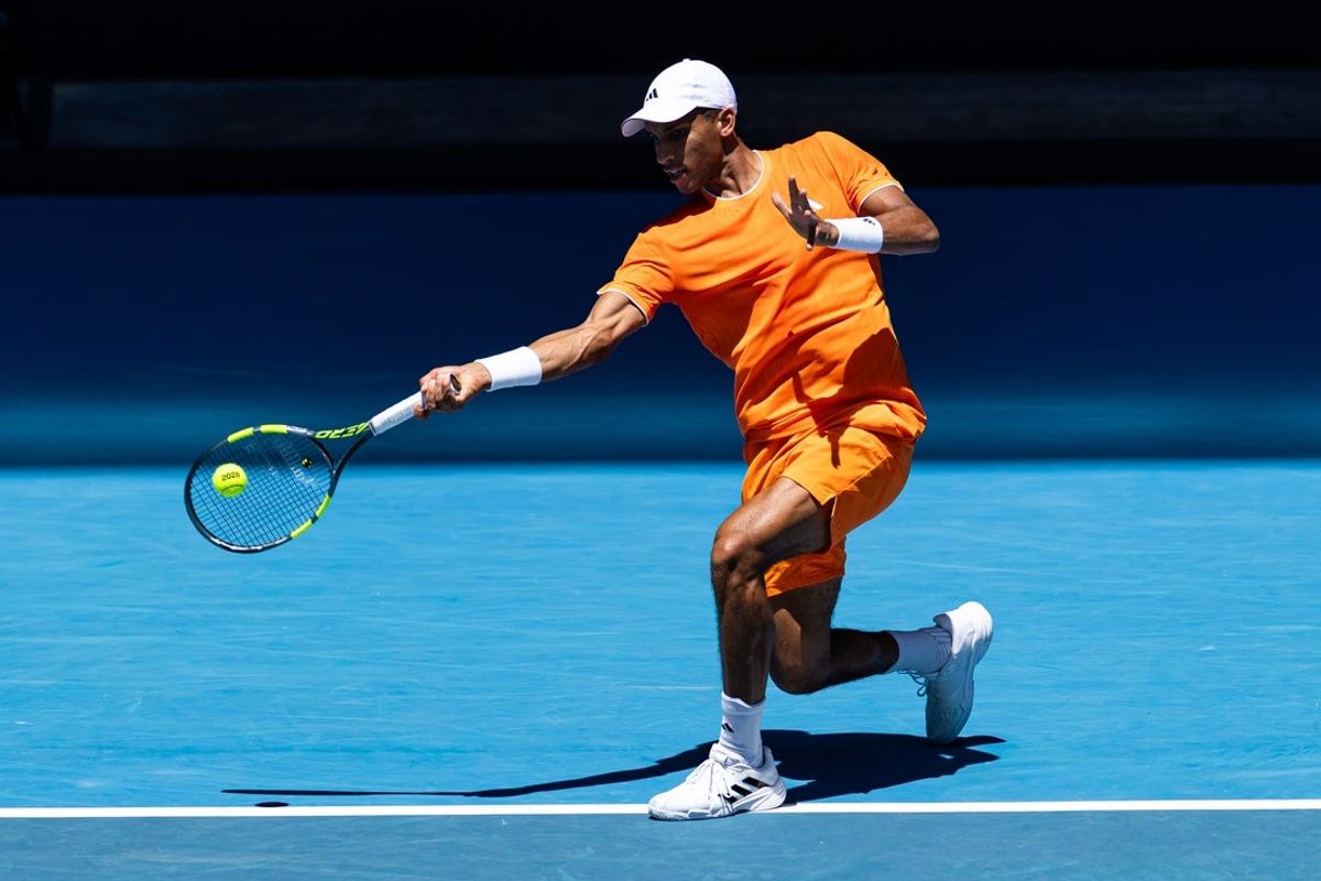 Jan 19, 2026; Melbourne, Victoria, Australia; Felix Auger-Aliassime of Canada in action against Nuno Borges of Portugal in the first round of the men’s singles at the Australian Open at John Cain Arena in Melbourne Park. Mandatory Credit: Mike Frey-Imagn Images