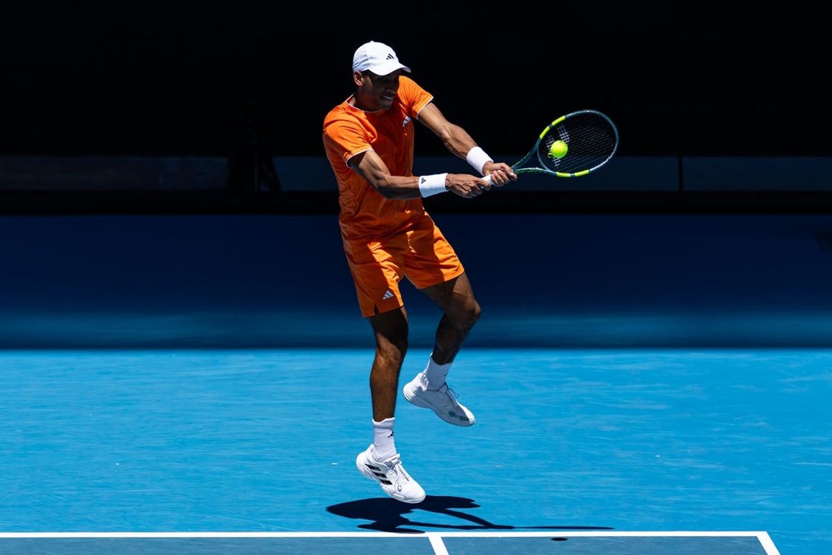 Jan 19, 2026; Melbourne, Victoria, Australia; Felix Auger-Aliassime of Canada in action against Nuno Borges of Portugal in the first round of the men’s singles at the Australian Open at John Cain Arena in Melbourne Park. Mandatory Credit: Mike Frey-Imagn Images