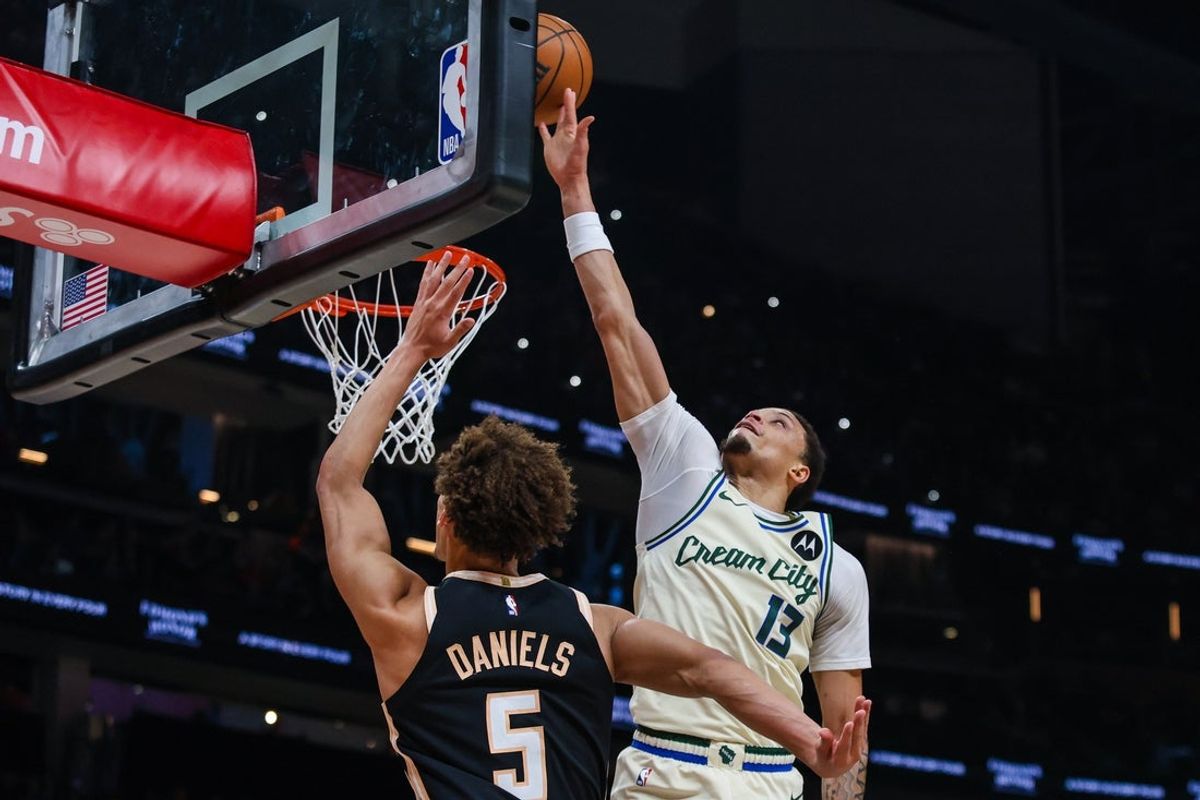 Jan 19, 2026; Atlanta, Georgia, USA; Atlanta Hawks guard Dyson Daniels (5) attempts a  shot against Milwaukee Bucks guard Ryan Rollins (13) during the first quarter at State Farm Arena. Mandatory Credit: Jordan Godfree-Imagn Images